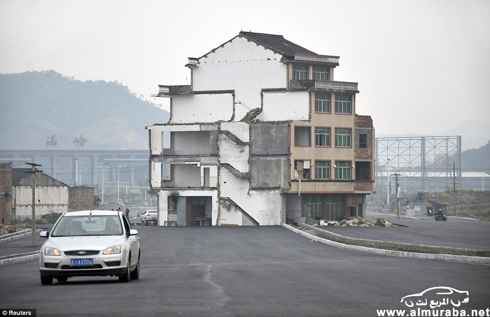 صيني رفض "بيع بيته" الى الحكومة من اجل تسوية طريق السيارات في مقاطعة تشجيانغ فأصبح هكذا "صور" 19