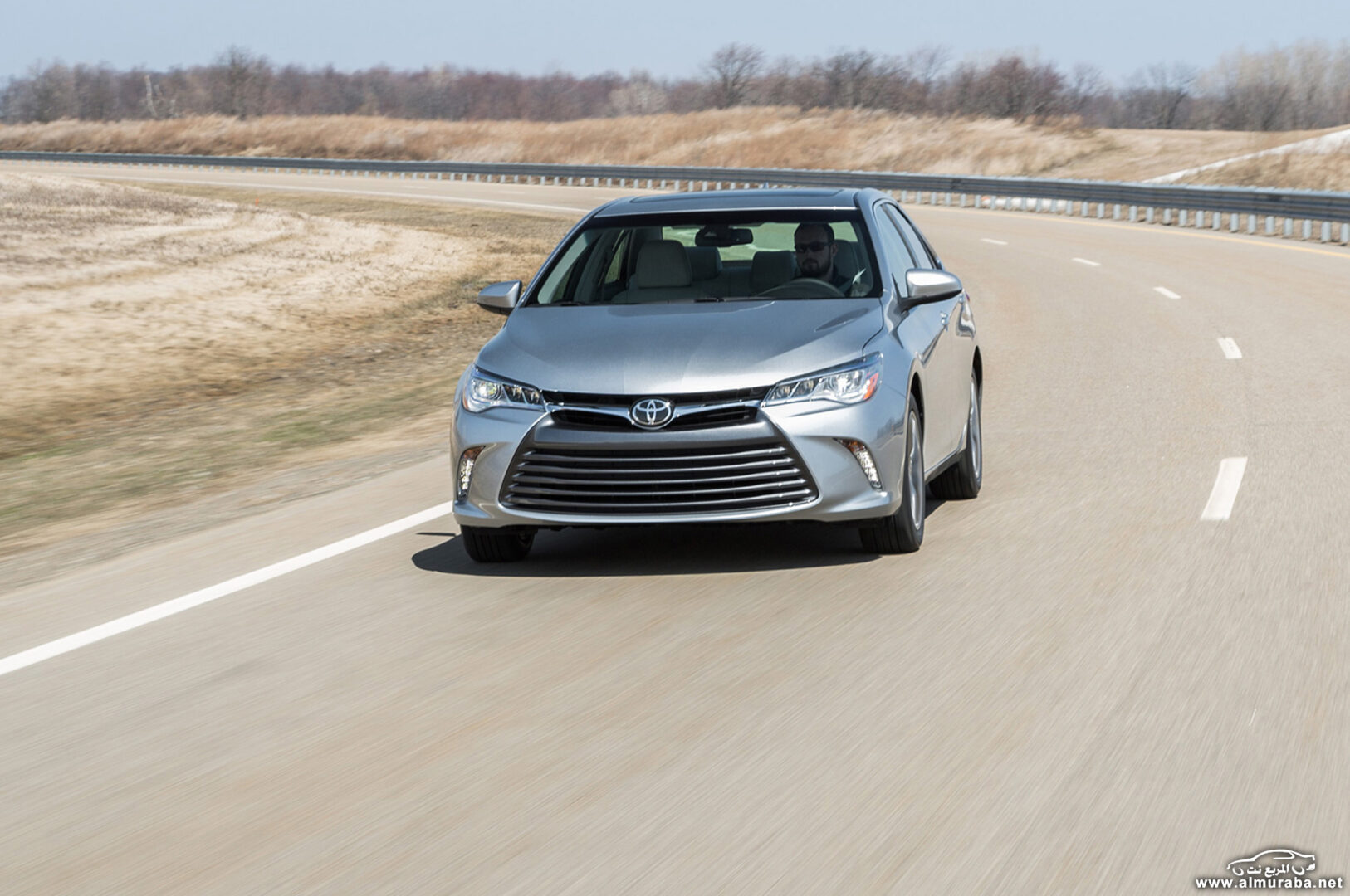 http---image.motortrend.com-f-roadtests-sedans-1404_2015_toyota_camry_first_look-72627078-2015-Toyota-Camry-XLE-front-view-on-road
