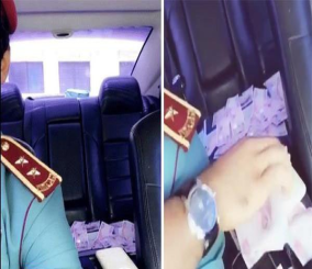 “فيديو“ شاهد ضابط إماراتي يستعرض بالنقود داخل سيارته.. والشرطة توقفه 3